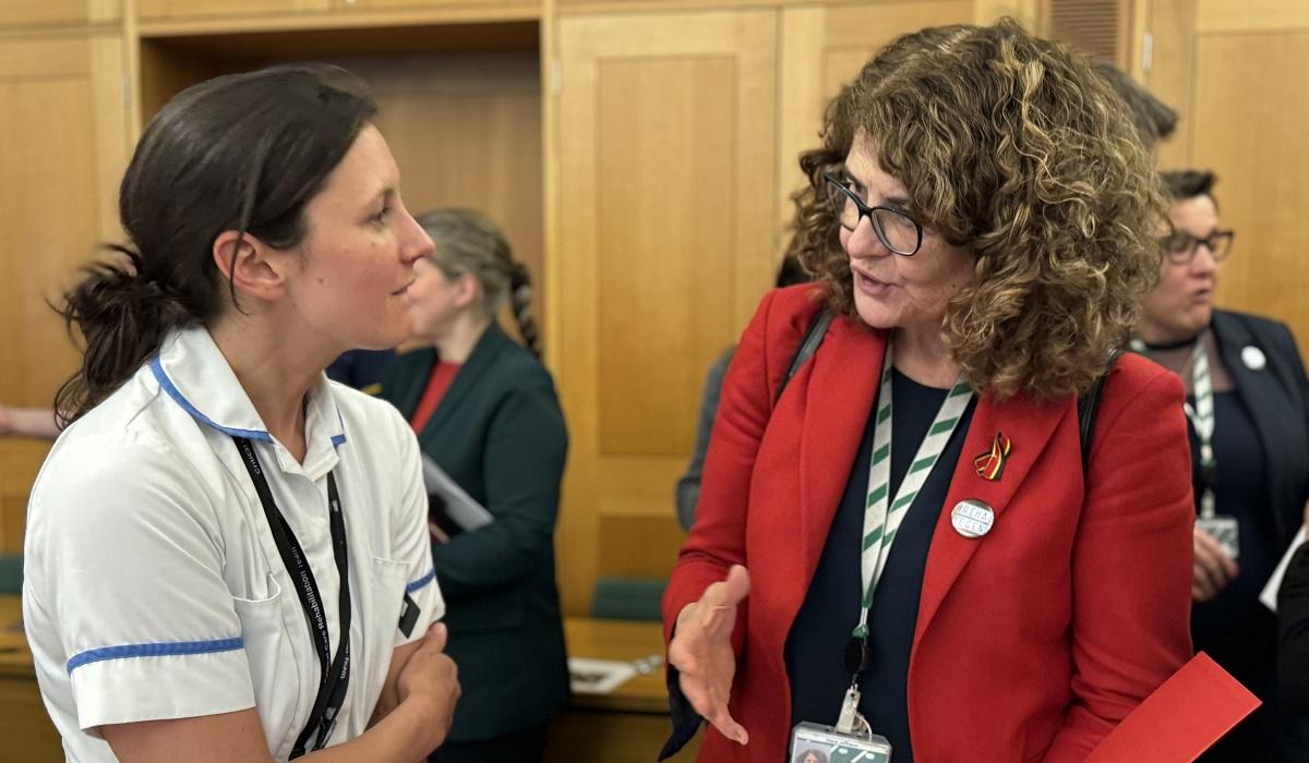 Diana Johnson MP talks to a healthcare professional in Parliament