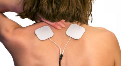 Woman with electrotherapy pads
