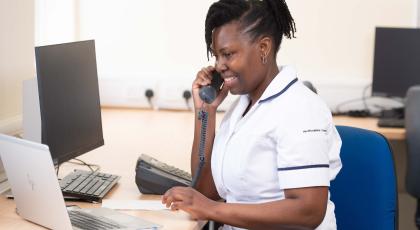 Hospital physio uses phone and computer