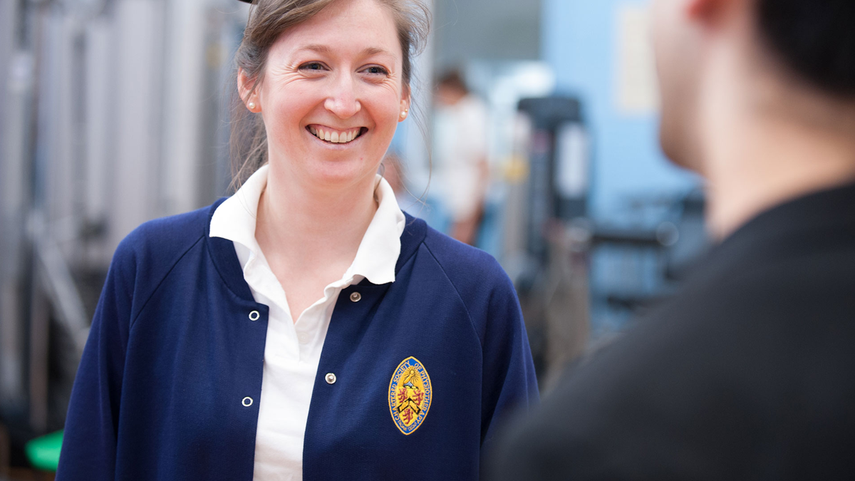 physio with patient 1200x675px Chartered physio having friendly conversation with patient