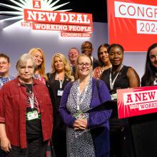 The CSP's delegation and non-voting guests at the TUC's podium.  (R) Jess Hurd.