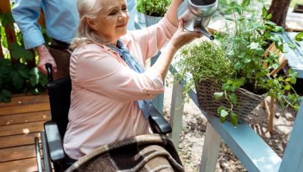 Lady in wheelchair doing some gardening